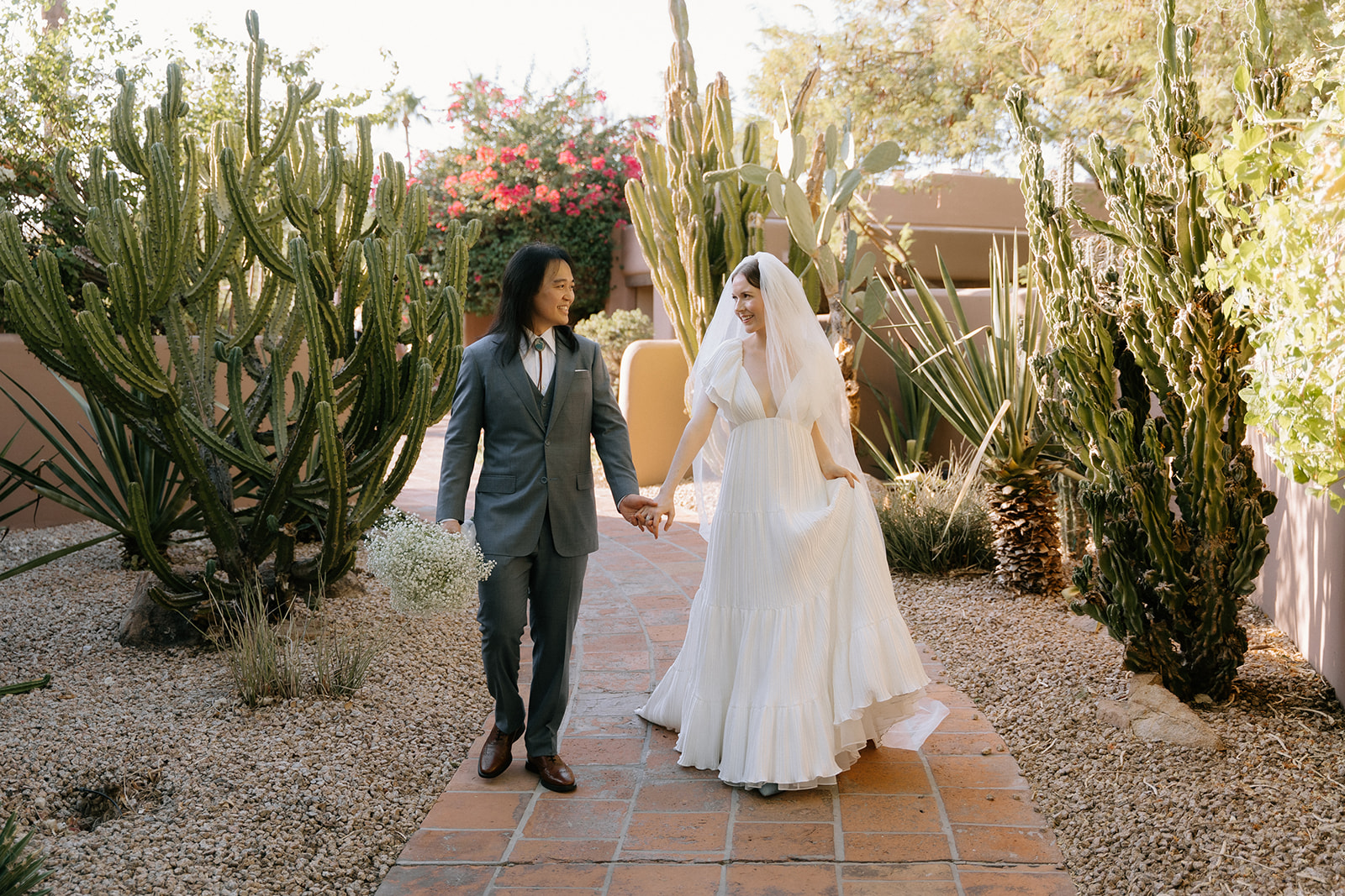 Couple before wedding walking around The Hermosa Inn.